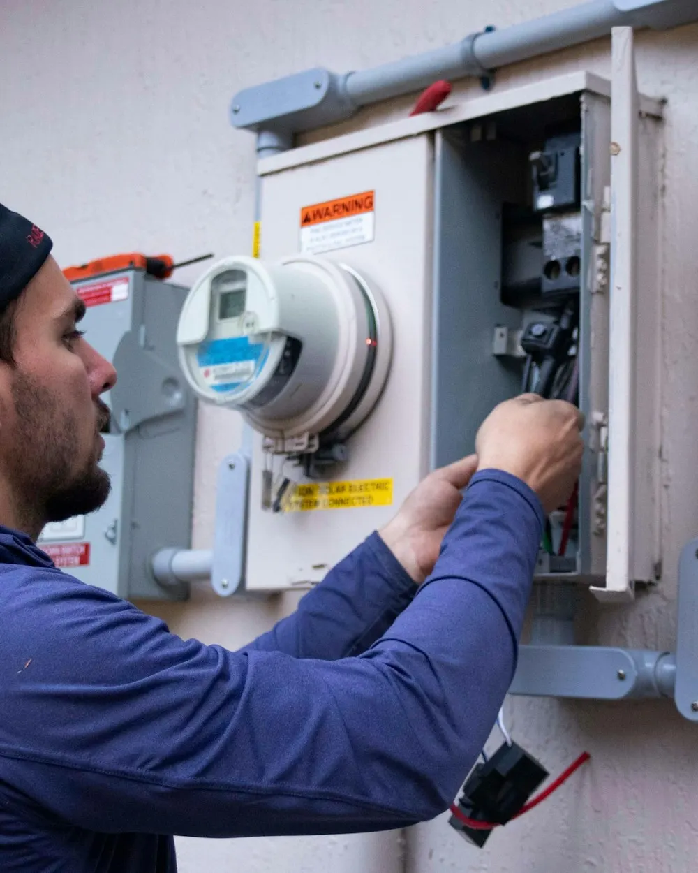Technician working on a residential electrical panel
